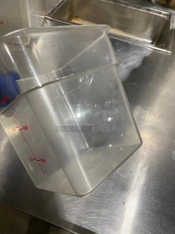 Cambro clear polycarbonate 4 qt. food container with red measurement markings, in good condition.