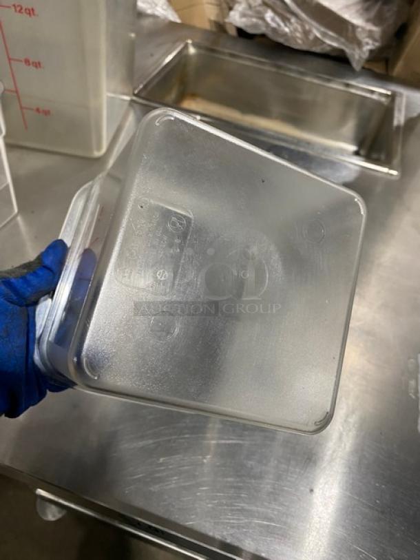 Cambro Commercial 4 Qt. Clear Polycarbonate Food Container, used, with visible manufacturer's label detailing capacity.