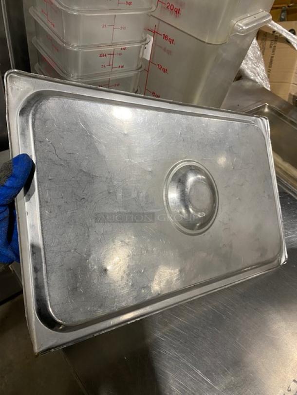 Commercial stainless steel steamtable pan lid with handle, gently used, 15x bid multiplier, dimensions not specified.