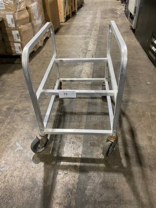 Commercial heavy-duty utility cart on casters. Metal frame, open design, used condition. Tag shows "T3".