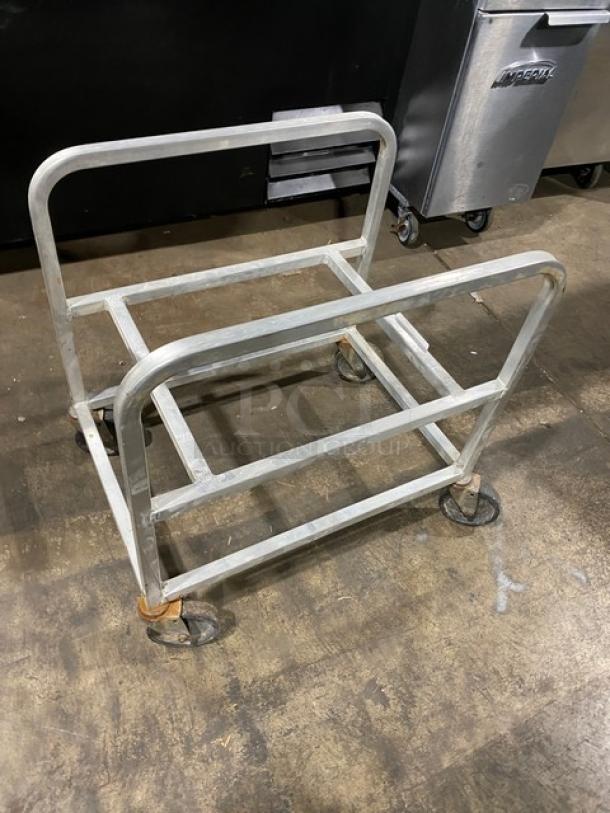 Commercial heavy-duty utility cart on casters, metal frame, ideal for bulk moving. Used condition, visible signs of wear.
