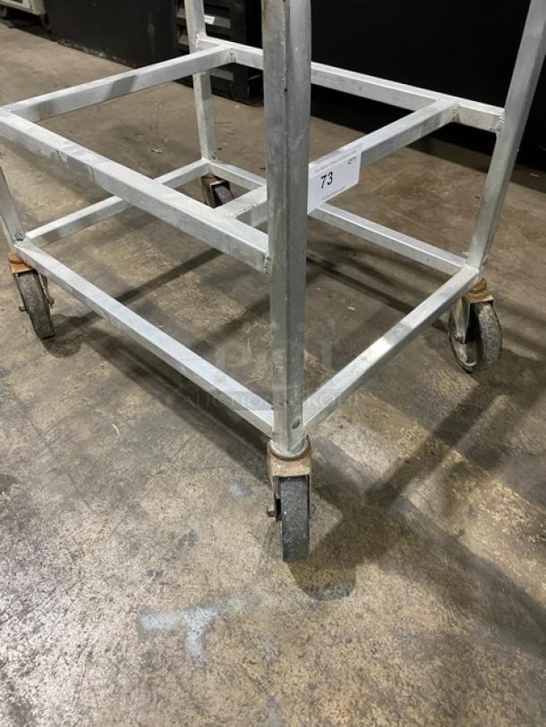 Commercial heavy-duty bulk mover utility cart with casters, metal frame, visible wear, tag marked "73."