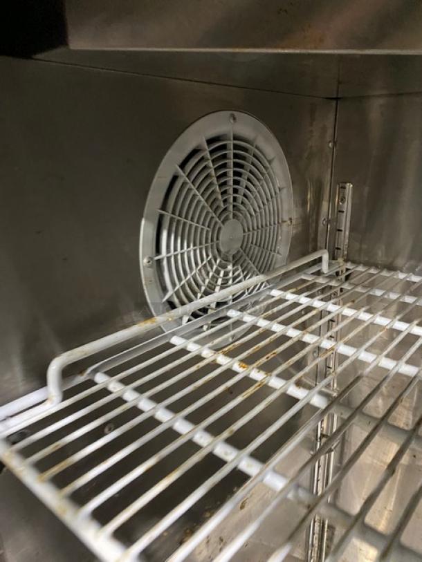 Atosa SBB48GGR cooler interior showing poly coated wired rack and fan. Clean condition with visible stainless steel surfaces.