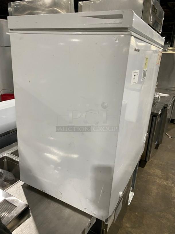 Hisense WCF070M6RWD commercial white chest freezer, slightly scuffed, 115V, serial number visible, ideal for bulk storage.