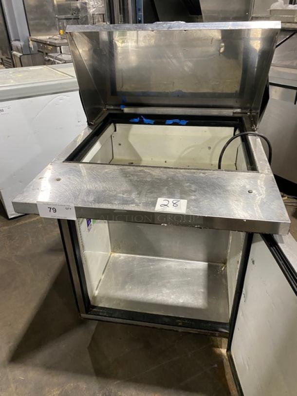 True TSSU-27-12M-B stainless steel refrigerated prep table, open lid, on casters, commercial use, serial 1-3764874, 115V.