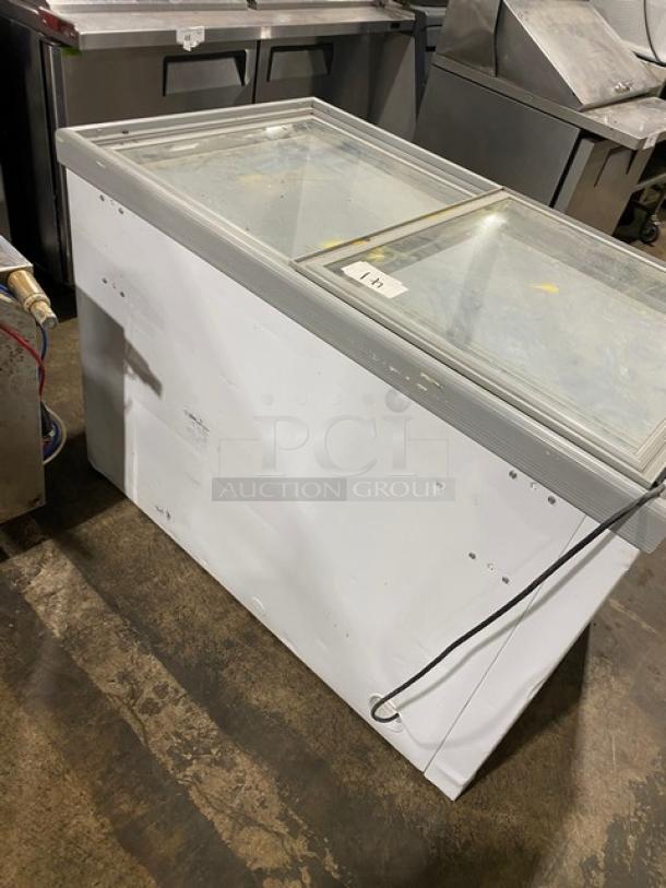 Electrolux commercial white double glass sliding-top freezer, model KCG150LW0, with poly-coated wire rack.