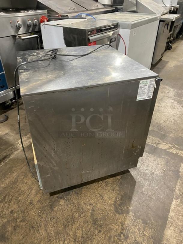 Beverage-Air UCF27AHC-23 stainless steel undercounter freezer on casters, single solid door, 115V, visible wear, serial: 12800182.