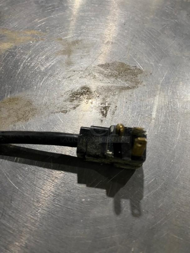 Power plug for Beverage-Air UCF27AHC-23 undercounter freezer, showing minor wear. 115V, single-phase; accommodates commercial use.