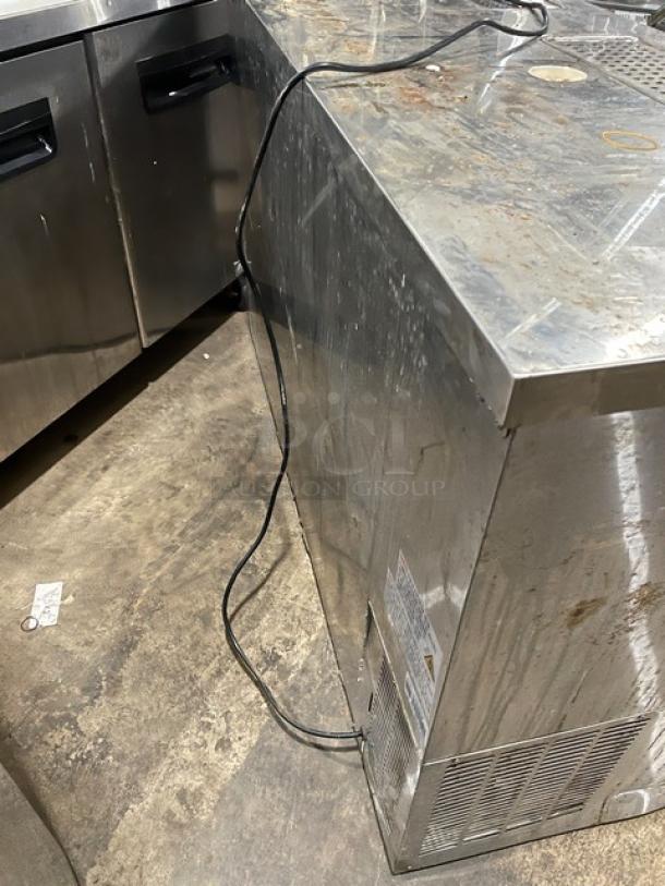 Avantco 178UDD60HCS commercial stainless steel 2-door kegerator with double tower/tap cut-outs, drip tray, and power cord.
