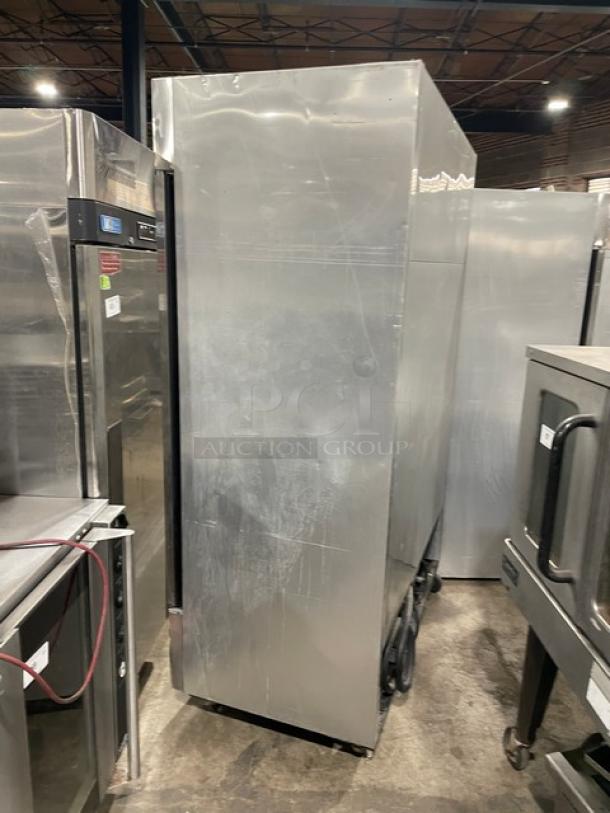 True T-49F stainless steel 2-door reach-in freezer with poly coated wire rack. Model: T-49F, SN: 11869638. On casters.