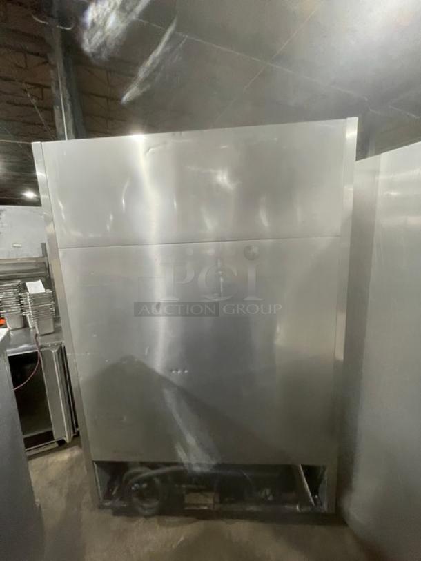 True T-49F commercial 2-door stainless steel reach-in freezer, includes poly-coated wire racks, on casters, good condition.