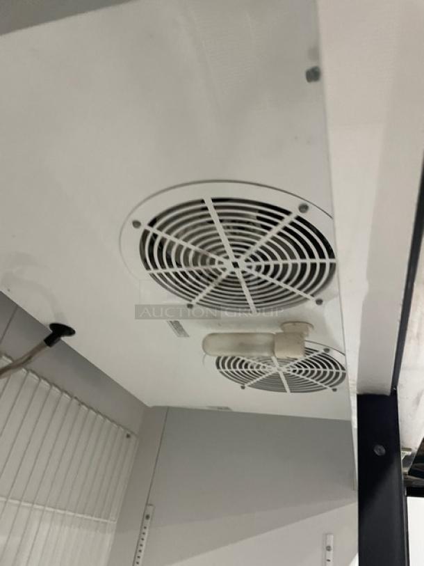 True T-49F stainless steel reach-in freezer, 2-door, poly-coated racks, 115V, 1 phase, on casters, model T-49F, SN: 11869638.