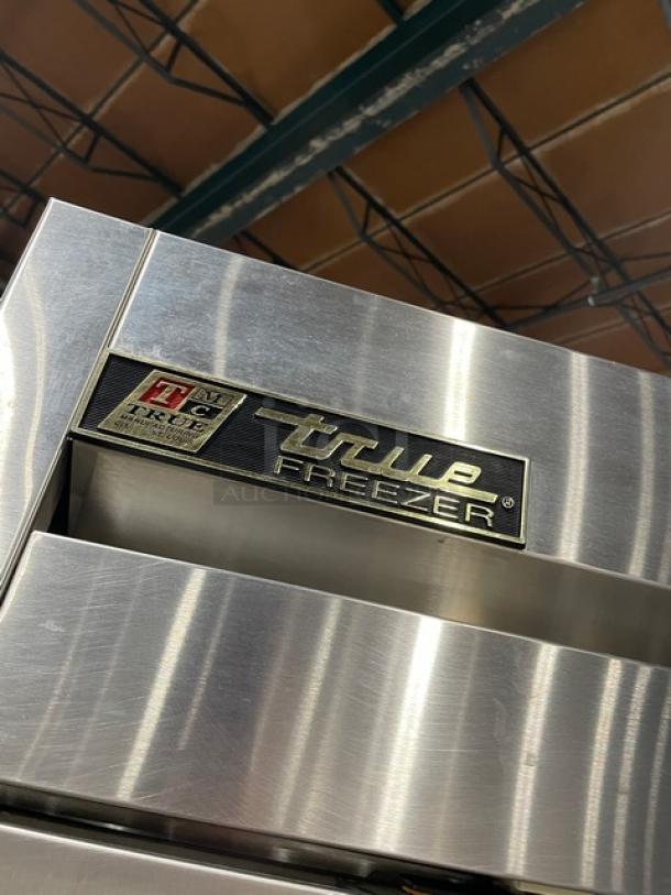 True T-49F commercial 2-door stainless steel reach-in freezer, with poly-coated wired rack, on casters. Model T-49F.