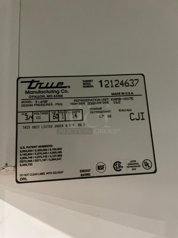 True Commercial Solid 2 Door Stainless Steel Freezer, Model T-49F, SN: 12124637, 115V 1 Phase, with Poly Coated Wired Racks.