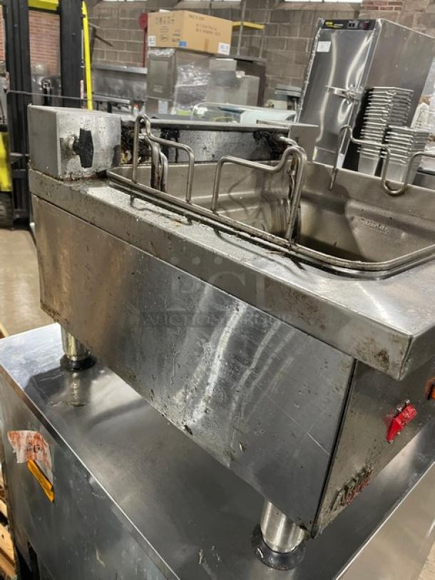 APW Wyott stainless steel electric countertop fryer with thermostatic control. Worn condition, mounted on legs.