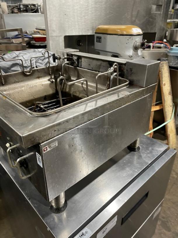 APW Wyott stainless steel countertop deep fat fryer with thermostatic control, on legs, electric powered, commercial use.