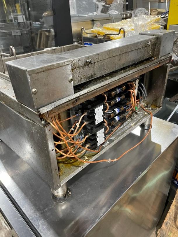 APW Wyott commercial stainless steel electric countertop deep fat fryer with thermostatic control. Mounted on legs.