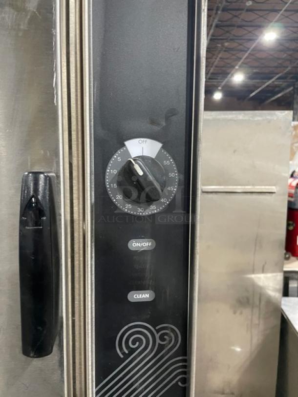 Groen HyPer Steam Series HY-5E steamer control panel, showing timer dial, and on/off and clean buttons in stainless steel.