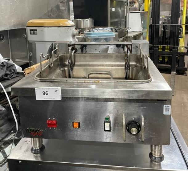APW Wyott stainless steel electric countertop deep fat fryer with thermostatic control, on legs, showcasing controls and tank.