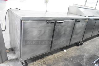 Beverage Air WTR72AY stainless steel 3-door undercounter cooler on casters, 115V, showing minor surface wear.