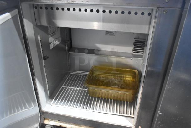 Beverage Air SPE72-30M stainless steel prep table inside view, features commercial casters, 115 volts, 1 phase.