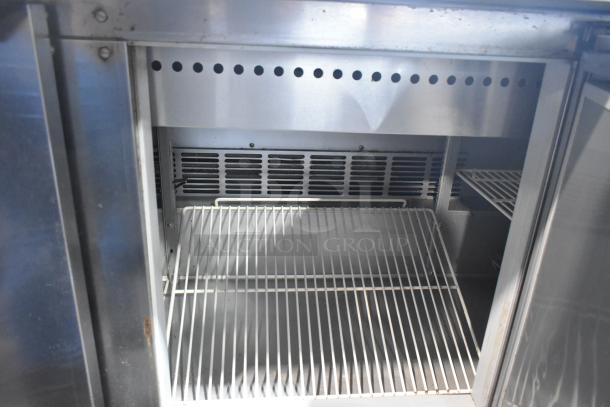 Beverage Air SPE72-30M stainless steel prep table interior, wire shelves, commercial casters, 115V, 1 phase.