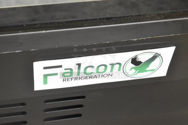 2023 Falcon ADC-163 metal deli display case on commercial casters, labeled Falcon Refrigeration, 115V, 1 Phase.