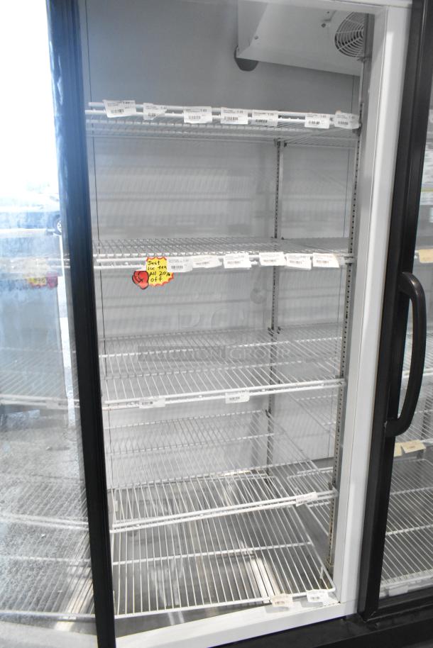 Master-Bilt MBGRP74-HG 3 Door Cooler Merchandiser, metal frame, poly coated racks, visible price tags, excellent condition.