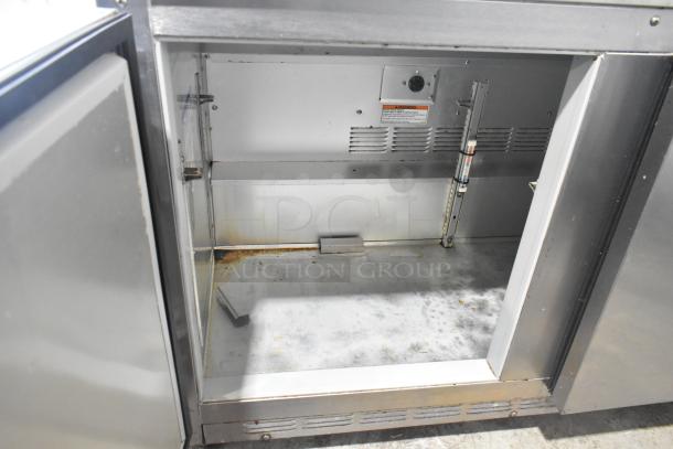 Beverage Air UCR48A stainless steel 2-door undercounter cooler on casters, 115 volts, interior shows wear and rust spots.