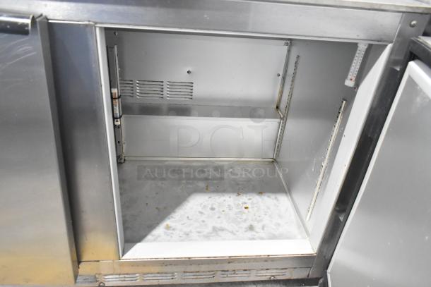 Beverage Air UCR48A stainless steel undercounter cooler, two doors, commercial casters, 115V, moderate wear visible.