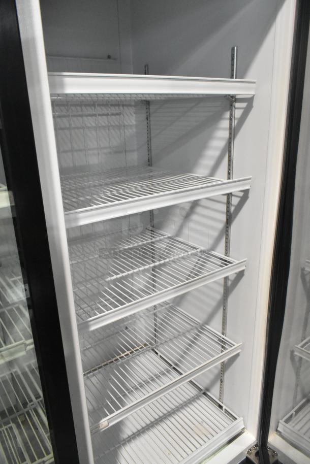 Master-Bilt MBGRP74-HG 3-door commercial cooler with poly-coated racks, metal frame, 115/208-240V, 1 phase.