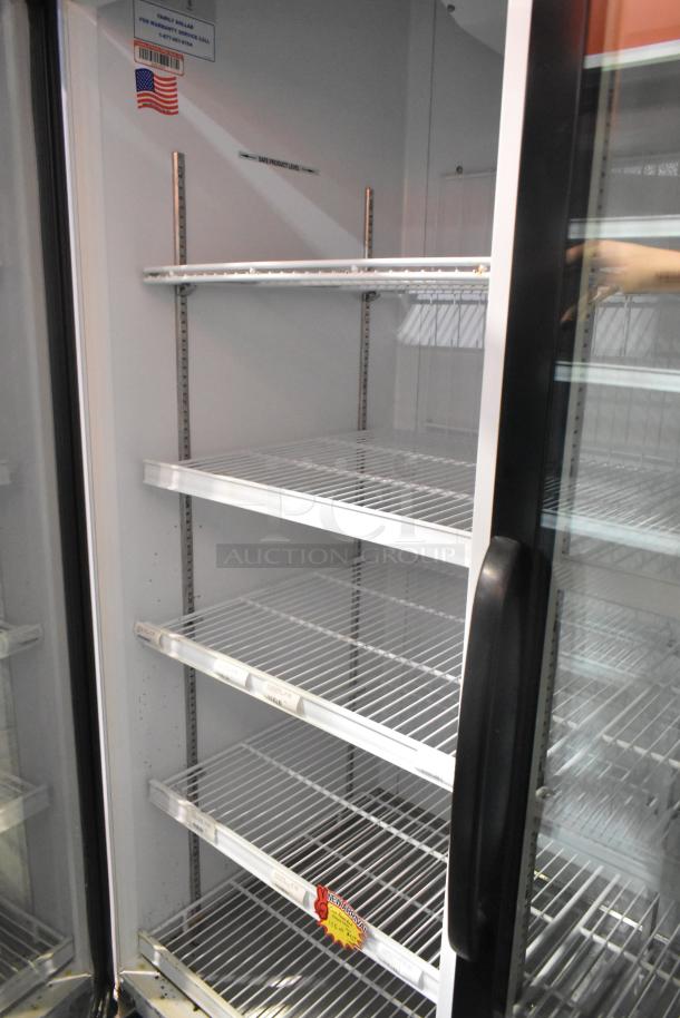 Master-Bilt MBGRP74-HG 3-door cooler merchandiser with poly coated racks, metal finish, and visible service label.
