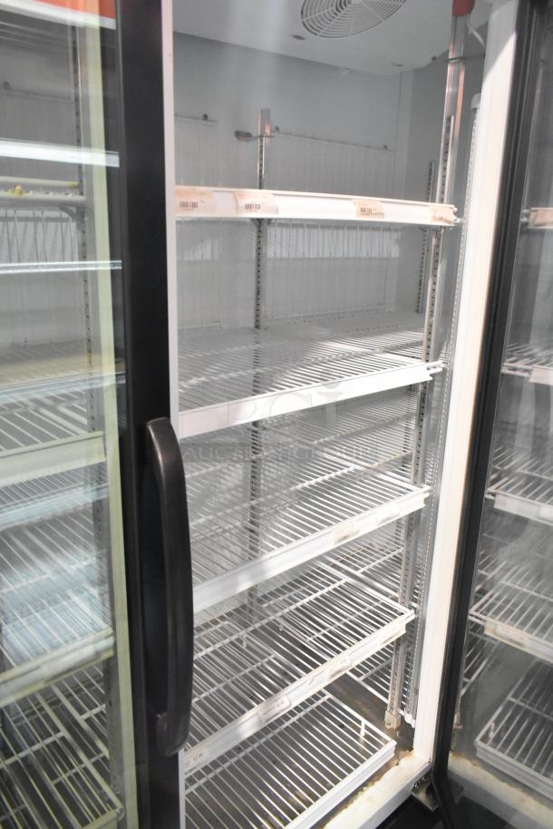 Master-Bilt MBGRP74-HG commercial 3-door reach-in cooler with poly coated racks; clean condition, 115/208-240V, 1 phase.