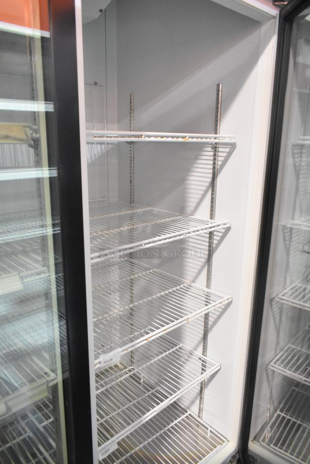 Master-Bilt MBGRP74-HG commercial cooler, 3-door, poly-coated racks, metal build, 115/208-240V, 1 phase, excellent condition.