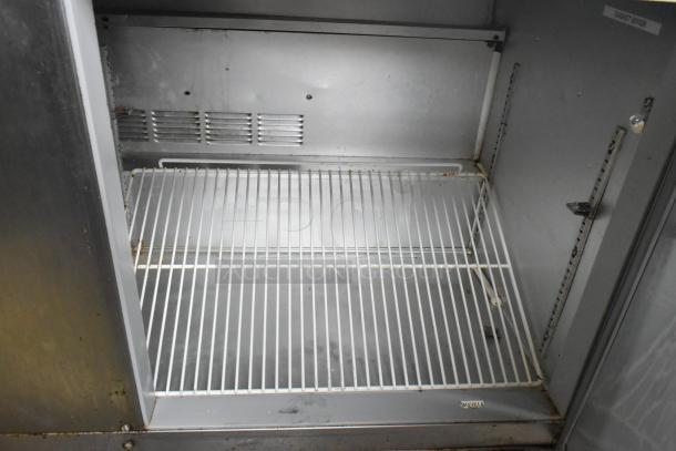 Beverage Air 3-door stainless steel undercounter cooler interior with wire shelving, on casters, 115V, 1 phase.