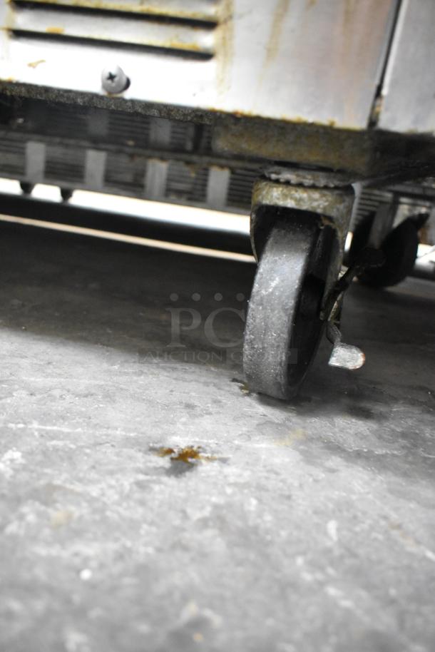 Beverage Air WTR60A stainless steel undercounter cooler on commercial casters, showing condition and mobility feature.