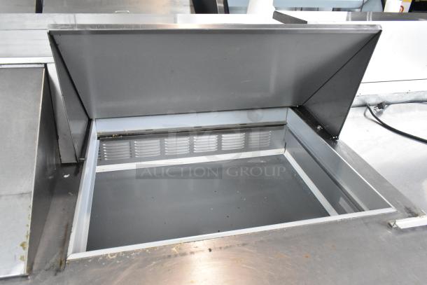 Beverage Air SPE60-24M stainless steel prep table with open bain marie compartment, on commercial casters, 115 volts.