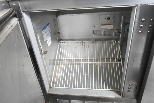 Beverage Air UCR48A stainless steel 2-door undercounter cooler, 115 volts, shown with interior shelving. Visible labels inside.