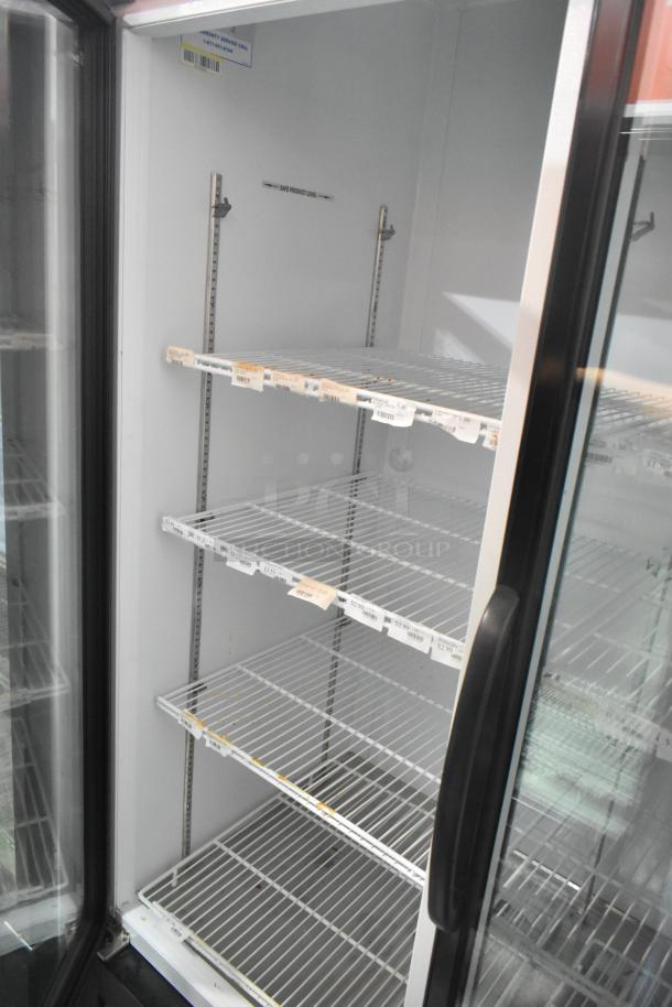 Master-Bilt MBGRP74-HG 3-door cooler with poly-coated racks, metal finish, and safety service label. 115/208-240V, 1 phase.