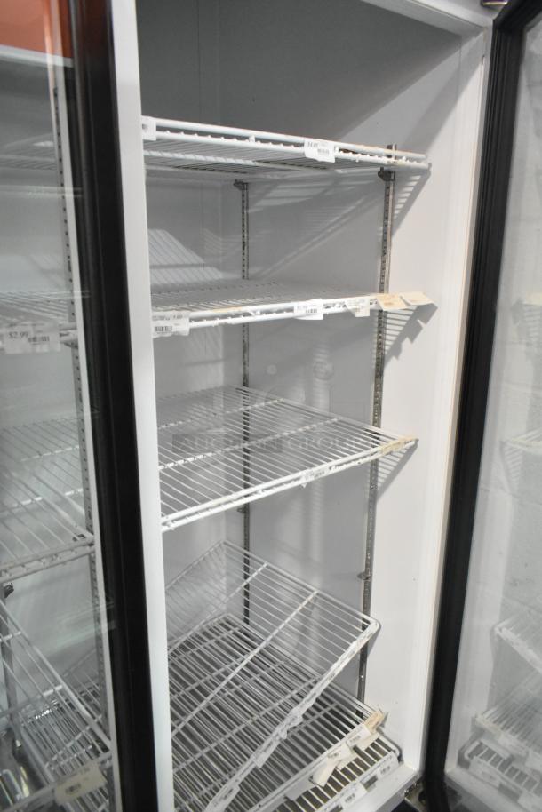 Master-Bilt MBGRP74-HG three-door cooler with poly coated racks shown. Tags display various product prices.