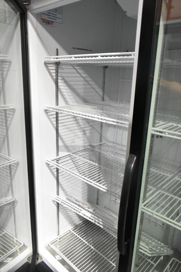 Master-Bilt MBGRP74-HG 3-door commercial cooler, poly-coated racks, excellent condition, 115/208-240V, 1 phase.