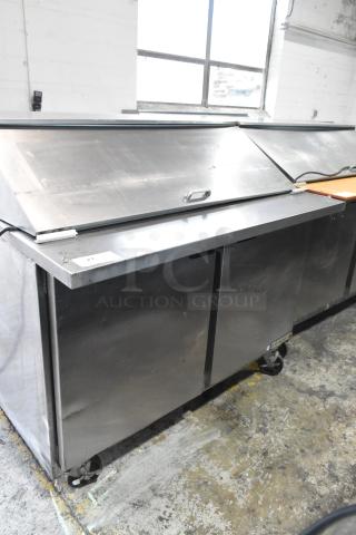 Beverage Air SPE48-18M-HMP stainless steel prep table, good condition, commercial casters, 115V, 1 phase, visible label.