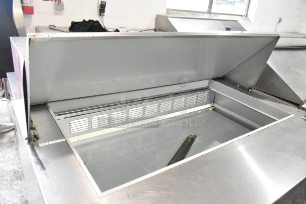 Beverage Air SPE48-18M-HMP stainless steel commercial prep table, 115V, on casters, with interior storage, used condition.