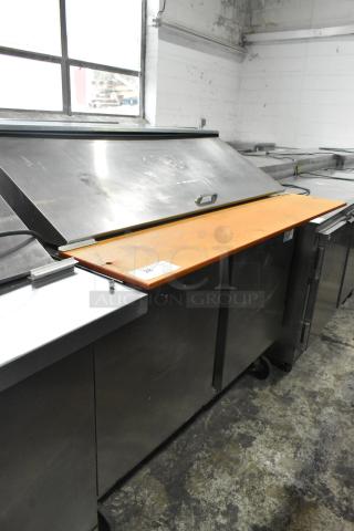 Beverage Air stainless steel sandwich salad prep table with cutting board, commercial casters, 115 volts, 1 phase, used.