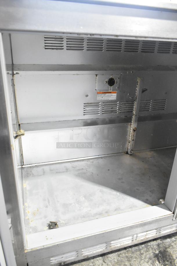Beverage Air UCR48A stainless steel 2-door undercounter cooler interior on casters, 115V, in used condition.