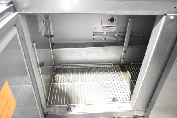 Beverage Air UCR48A-23-HMP stainless steel 2-door undercounter cooler, showing interior shelves and casters. 115V, 1 Phase.