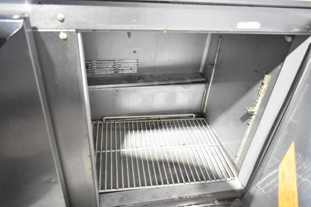 Beverage Air UCR48A-23-HMP stainless steel undercounter cooler, 2 doors, on casters. Interior view showing shelves. 115V, 1 phase.