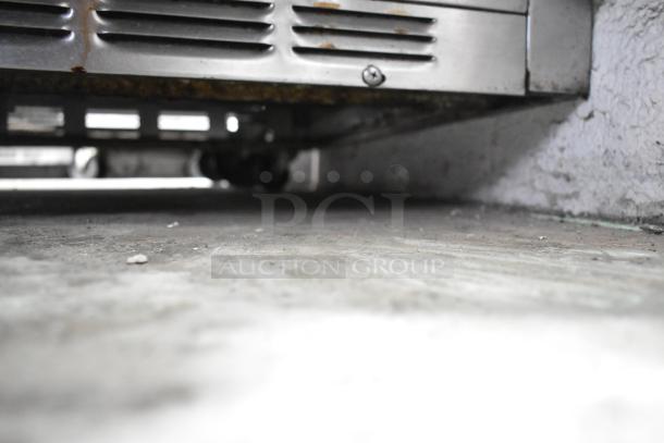 Beverage Air UCR48A stainless steel undercounter cooler, 2-door, on commercial casters, 115V, 1 phase; visible wear.