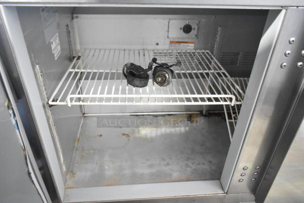 Beverage Air UCR48A stainless steel undercounter cooler, two doors, commercial casters inside, 115V, good condition.