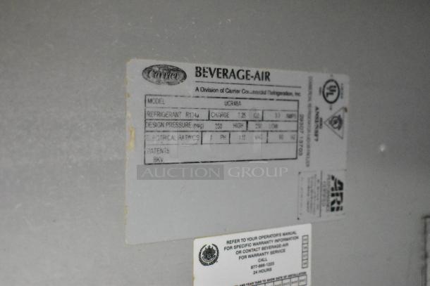 Beverage Air UCR48A stainless steel 2-door undercounter cooler label showing model, refrigerant details, and electrical ratings.